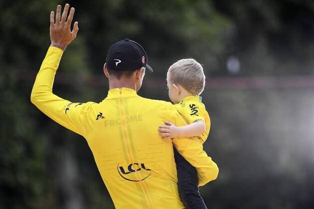 British Chris Froome of Team Sky and his son Kellan pictured after the twenty-first and final stage of the 104th edition of the Tour de France cycling race, from Montgeron to Paris (103km), France, Sunday 23 July 2017. This year s Tour de France takes place from July first to July 23rd. YORICKxJANSENS  x05137564x