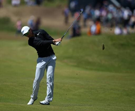 23rd July 2017, Royal Birkdale Golf Club, Southport, England; The 146th Open Golf Championship, fourth round ; Haotong Li hits his approach shot from the 8th fairway xDavidxBlunsdenx  ActionPlus11905764