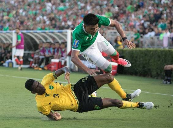 (170724) -- PASADENA, July 24, 2017 -- Damion Lowe (Bottom) of Jamaica vies with Jesus Gallardo of Mexico during the semifinal of the CONCACAF Gold Cup soccer tournament between Jamaica and Mexico at the Rose Bowl in Pasadena, the United States, on July 23, 2017. Jamaica advanced to the final with 1-0.) (wll) (SP)U.S.-PASADENA-SOCCER-CONCACAF GOLD CUP-SEMIFINAL-JAM VS MEX JavierxRojas 