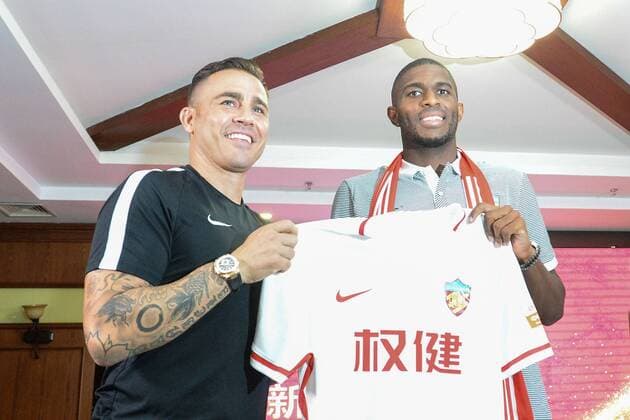 Italian head coach Fabio Cannavaro of Tianjin Quanjian Football Club, left, and French football star Anthony Modeste attend a press conference PK Pressekonferenz in Tianjin, China, 17 July 2017. Anthony Modeste  pbu653918_12