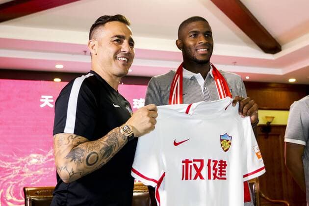 Italian head coach Fabio Cannavaro of Tianjin Quanjian Football Club, left, and French football star Anthony Modeste attend a press conference PK Pressekonferenz in Tianjin, China, 17 July 2017. Anthony Modeste  20170717_31038
