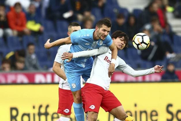 SOCCER - UEFA CL quali, RBS vs Rijeka SALZBURG,AUSTRIA,26.JUL.17 - SOCCER - UEFA Champions League qualification, Red Bull Salzburg vs HNK Rijeka. Image shows Alexander Gorgon (Rijeka) and Takumi Minamino (RBS). GEPAxpictures xFelixxRoittner