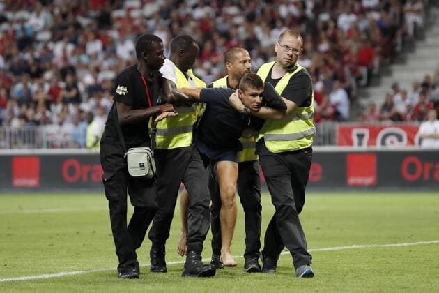 stewards with pitch intruder during the UEFA Champions League third round qualifying first leg match between OGC Nice and Ajax Amsterdam on July 26, 2017 at the Allianz Riviera in Nice, France OGC Nice v Ajax UEFA Champions League 2017 2018 xVIxVIxImagesx xMauricexvanxSteenxIVx 8317719