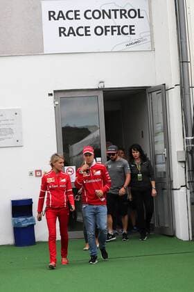 Hungarian Grand Prix, Hungaroring 27 - 30 July 2017 27.07.2017 - Britta Roeske (AUT) Ferrari Press Officer and Sebastian Vettel (GER) Scuderia Ferrari SF70H 