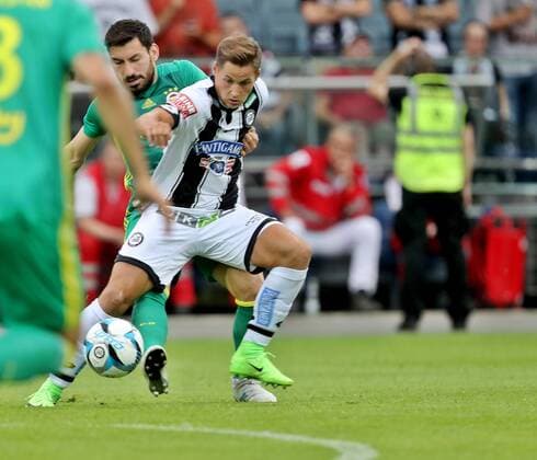 SOCCER - EL quali, Sturm vs Fenerbahce GRAZ,AUSTRIA,27.JUL.17 - SOCCER - UEFA Europa League qualification, SK Sturm Graz vs Fenerbahce Istanbul. Image shows Thorsten Roecher (Sturm) and Sener Oezbayrakli (Fenerbahce). GEPAxpictures xHansxOberlaender