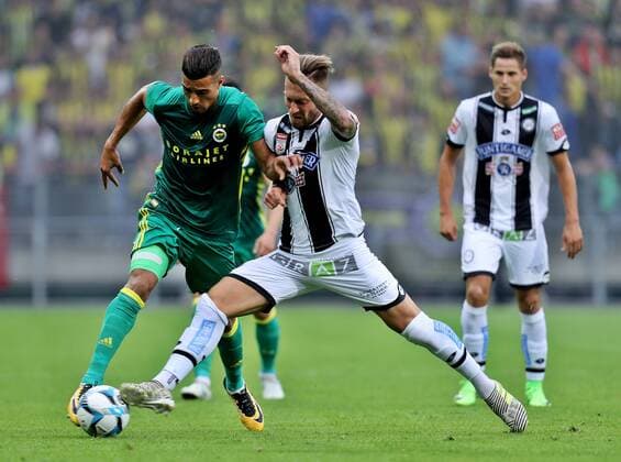 SOCCER - EL quali, Sturm vs Fenerbahce GRAZ,AUSTRIA,27.JUL.17 - SOCCER - UEFA Europa League qualification, SK Sturm Graz vs Fenerbahce Istanbul. Image shows Nabil Dirar (Fenerbahce) and Peter Zulj (Sturm). GEPAxpictures xM.xOberlaender