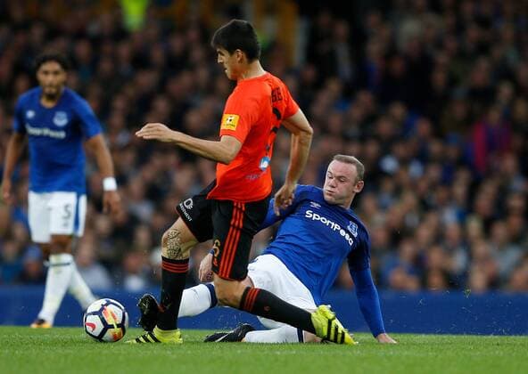 Wayne Rooney of Everton tackles Kristi Qose of MFK Ruzomberok during the Europa League Qualifying Third Round 1st leg match at Goodison Park Stadium, Liverpool. Picture date: March 27th 2017. Pic credit should read: Simon Bellis Sportimage EDITORIAL USE ONLY. No use with unauthorised audio, video, data, fixture lists, club league logos or live services. Online in-match use limited to 120 images, no video emulation. No use in betting, games or single club league player publications.