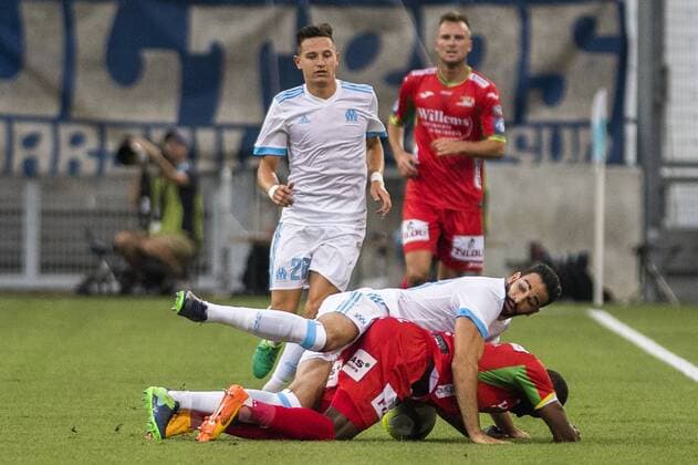 Marseille s Adil Rami and Oostende s Joseph Akpala fight for the ball during a soccer game between French club Olympique de Marseille and Belgian team KV Oostende, the first leg of the third qualifying round for the UEFA Europa League competition, Thursday 27 July 2017 in Marseille. LAURIExDIEFFEMBACQ  x05139871x