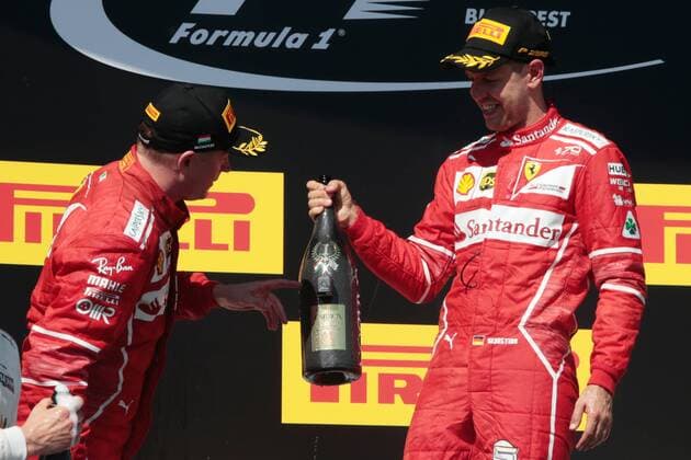 FORMULA 1 - Hungarian GP BUDAPEST,HUNGARY,30.JUL.17 - MOTORSPORTS, FORMULA 1 - Grand Prix of Hungary, Hungaroring. Image shows Kimi Raikkoenen (FIN Ferrari) and Sebastian Vettel (GER Ferrari). Keywords: award ceremony, champagne shower. GEPAxpictures xFritzxMueller