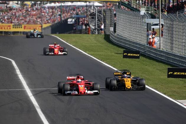 Hungarian Grand Prix, Hungaroring 27 - 30 July 2017 30.07.2017 - Race, Sebastian Vettel (GER) Scuderia Ferrari SF70H and Nico Hulkenberg (GER) Renault F1 Team RS17 