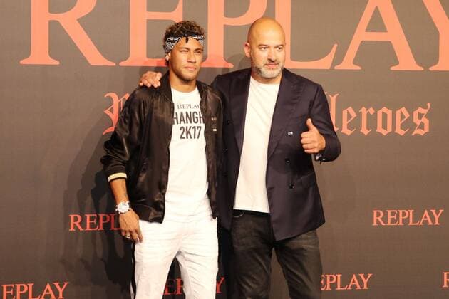 Brazilian football star Neymar, left, or Neymar Jr., poses as he arrives at the fashion show of the Replay Fall Winter 2017 18 collection with a label heritage for new Rebels & Heroes in Shanghai, China, 31 July 2017. Neymar flashes trendy look to highlight Replay Fall Winter 2017 18 collection show in Shanghai  20170731_49268