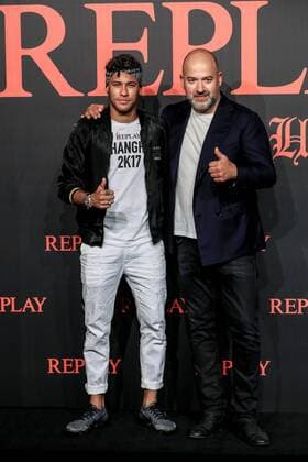 Brazilian football star Neymar, left, or Neymar Jr., poses as he arrives at the fashion show of the Replay Fall Winter 2017 18 collection with a label heritage for new Rebels & Heroes in Shanghai, China, 31 July 2017. Neymar flashes trendy look to highlight Replay Fall Winter 2017 18 collection show in Shanghai  pbu660737_17