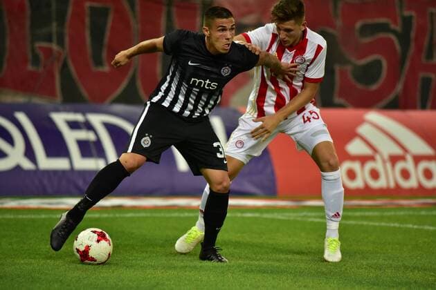 Greece: Olympiacos vs Partizan Uros Djurdjevic (no 32) of Partizan tries to avoid Panagiotis Retsos (no 45) of Olympiacos.  DimitriosxKarvountzis PacificxPress
