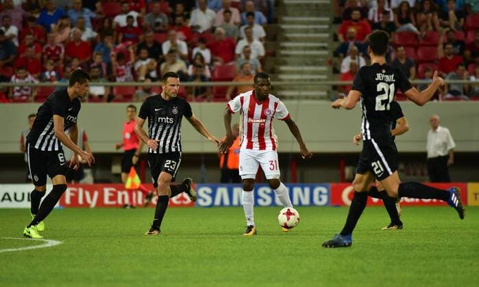 Greece: Olympiacos vs Partizan El Fardou Ben Nabouhane (no 31) of Olympiacos tries to pass the ball while he is surrounded by players of Partizan.  DimitriosxKarvountzis PacificxPress