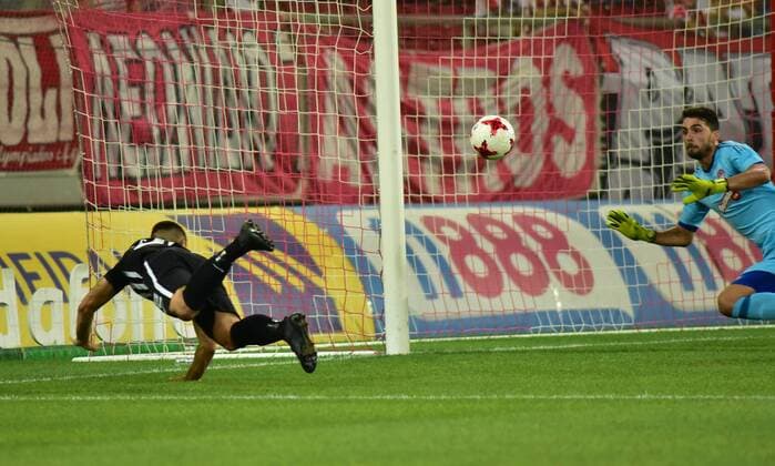 Greece: Olympiacos vs Partizan Attempt of Uros Djurdjevic ( no 32) of Partizan to score against Olympiacos was stopped by Stefano Kapino (no 27) goalkeeper of Olympiacos.  DimitriosxKarvountzis PacificxPress