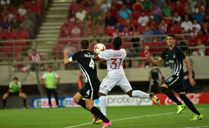 Greece: Olympiacos vs Partizan El Fardou Ben Nabouhane (no 31) of Olympiacos controls the ball and tries to attack while Miroslav Vulicevic (no 4) of Partizan tris to stop him.  DimitriosxKarvountzis PacificxPress