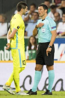 Gent s Stefan Mitrovic receives a yellow card from Referee Nicolas Rainville at a soccer game between Austrian team SC Rheindorf Altach and Belgian club KAA Gent, the return leg of the third qualifying round for the UEFA Europa League competition, Thursday 03 August 2017 in Altach, Austria. The first leg resulted in a 1-1 draw. JASPERxJACOBS  x05143208x