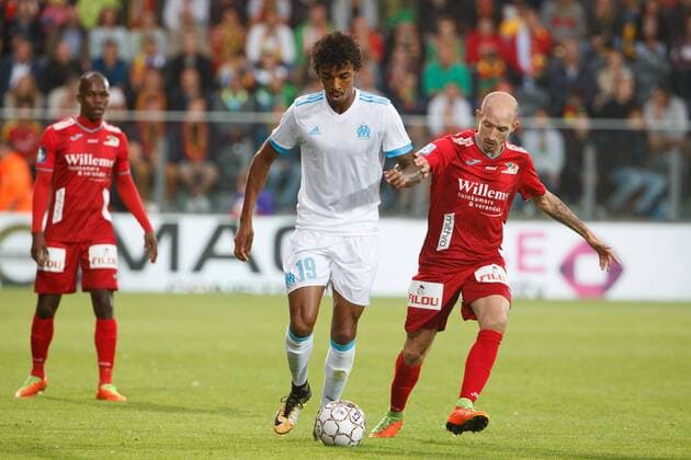 Marseille s Luiz Gustavo and Oostende s Franck Berrier fight for the ball during a soccer game between Belgian team KV Oostende and French club Olympique de Marseille, the return leg of the third qualifying round for the UEFA Europa League competition, Thursday 03 August 2017 in Oostende. Marseille won the first leg with a 4-2 score. KURTxDESPLENTER  x05143299x