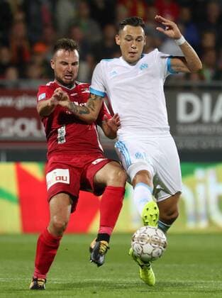 Oostende s Antonio Milic and Marseille s Lucas Ocampos fight for the ball during a soccer game between Belgian team KV Oostende and French club Olympique de Marseille, the return leg of the third qualifying round for the UEFA Europa League competition, Thursday 03 August 2017 in Oostende. Marseille won the first leg with a 4-2 score. VIRGINIExLEFOUR  x05143352x
