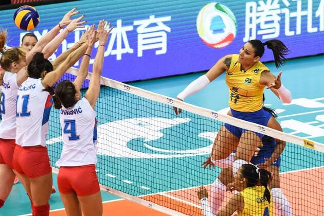 (From left)Brankica Mihajlovic, Stefana Veljkovic, and Bojana Zivkovic of Serbia spike against Tandara Caixeta of Brazil during their match of the FIVB Volleyball World Grand Prix Finals 2017 in Nanjing city, east China s Jiangsu province, 5 August 2017. Brazil defeated Serbia 3-1 (20-25, 25-23, 25-14, 25-23). Brazil eliminates Serbia at FIVB Volleyball World Grand Prix Finals 2017  20170805_60051