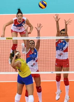 Natalia Pereira of Brazil spikes against Bojana Zivkovic and Stefana Veljkovic of Serbia during their match of the FIVB Volleyball World Grand Prix Finals 2017 in Nanjing city, east China s Jiangsu province, 5 August 2017. Brazil defeated Serbia 3-1 (20-25, 25-23, 25-14, 25-23). Brazil eliminates Serbia at FIVB Volleyball World Grand Prix Finals 2017  20170805_60050