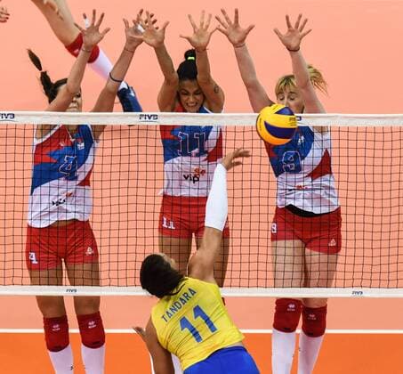 Tandara Caixeta of Brazil spikes against (from left) Bojana Zivkovic, Stefana Veljkovic, and Brankica Mihajlovic of Serbia during their match of the FIVB Volleyball World Grand Prix Finals 2017 in Nanjing city, east China s Jiangsu province, 5 August 2017. Brazil defeated Serbia 3-1 (20-25, 25-23, 25-14, 25-23). Brazil eliminates Serbia at FIVB Volleyball World Grand Prix Finals 2017  20170805_80130