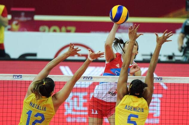 Natalia Pereira, left, and Adenizia Da Silva of Brazil spike against Stefana Veljkovic of Serbia during their match of the FIVB Volleyball World Grand Prix Finals 2017 in Nanjing city, east China s Jiangsu province, 5 August 2017. Brazil defeated Serbia 3-1 (20-25, 25-23, 25-14, 25-23). Brazil eliminates Serbia at FIVB Volleyball World Grand Prix Finals 2017  20170805_80266