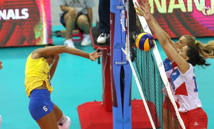 Adenizia Da Silva of Brazil spikes against Ana Antonijevic, back, and Milena Rasic of Serbia during their match of the FIVB Volleyball World Grand Prix Finals 2017 in Nanjing city, east China s Jiangsu province, 5 August 2017. Brazil defeated Serbia 3-1 (20-25, 25-23, 25-14, 25-23). Brazil eliminates Serbia at FIVB Volleyball World Grand Prix Finals 2017  20170805_80423