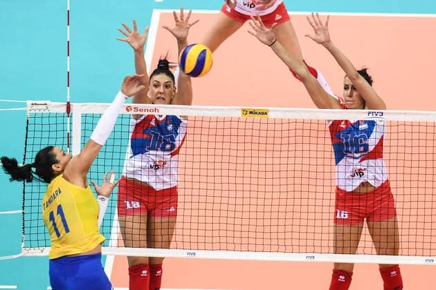 Tandara Caixeta of Brazil spikes against Tijana Boskovic and Milena Rasic of Serbia during their match of the FIVB Volleyball World Grand Prix Finals 2017 in Nanjing city, east China s Jiangsu province, 5 August 2017. Brazil defeated Serbia 3-1 (20-25, 25-23, 25-14, 25-23). Brazil eliminates Serbia at FIVB Volleyball World Grand Prix Finals 2017  20170805_05537