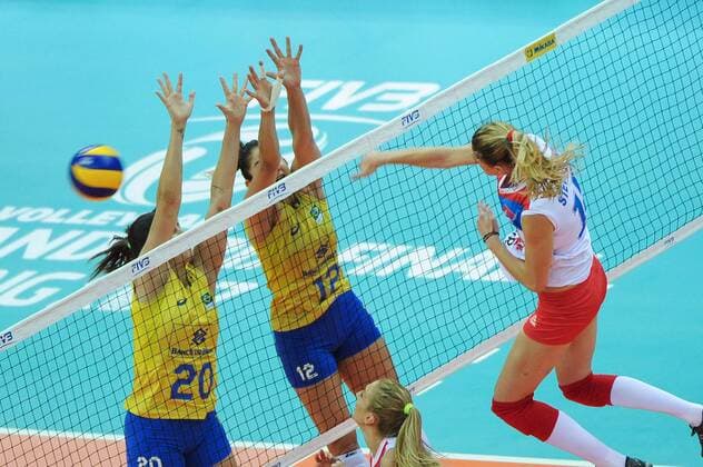 Jovana Stevanovic of Serbia spikes against Ana Beatriz Correa and Natalia Pereira of Brazil during their match of the FIVB Volleyball World Grand Prix Finals 2017 in Nanjing city, east China s Jiangsu province, 5 August 2017. Brazil defeated Serbia 3-1 (20-25, 25-23, 25-14, 25-23). Brazil eliminates Serbia at FIVB Volleyball World Grand Prix Finals 2017  20170805_05667