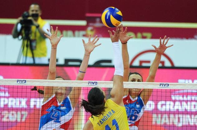Tandara Caixeta of Brazil spikes against Bojana Zivkovic and Milena Rasic of Serbia during their match of the FIVB Volleyball World Grand Prix Finals 2017 in Nanjing city, east China s Jiangsu province, 5 August 2017. Brazil defeated Serbia 3-1 (20-25, 25-23, 25-14, 25-23). Brazil eliminates Serbia at FIVB Volleyball World Grand Prix Finals 2017  20170805_05671