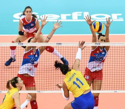 Tandara Caixeta of Brazil spikes against Bojana Zivkovic and Milena Rasic of Serbia during their match of the FIVB Volleyball World Grand Prix Finals 2017 in Nanjing city, east China s Jiangsu province, 5 August 2017. Brazil defeated Serbia 3-1 (20-25, 25-23, 25-14, 25-23). Brazil eliminates Serbia at FIVB Volleyball World Grand Prix Finals 2017  20170805_05539