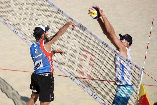 Beach volleyball Beachvolleyball - FIVB World Championships 2017 VIENNA,AUSTRIA,05.AUG.17 - BEACH VOLLEYBALL - FIVB World Championships, men. Image shows Phil Dalhausser (USA) and Viacheslav Krasilnikov (RUS). GEPAxpictures xMaticxKlansek