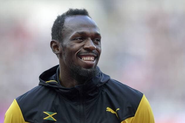 170806 Jamaicas Usain Bolt ler vid prisutdelningen för 100 meter under dag tre av friidrotts-VM den 6 augusti 2017 i London.  Copyright: JOELxMARKLUND BB170806JM101