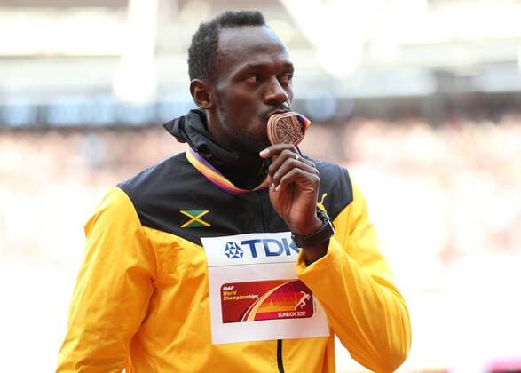 August 6th 2017, London Stadium, East London, England; IAAF World Championships; Day 3; Usain Bolt of Jamaica kisses the Bronze medal for finishing 3rd in the Men s 100 metres final xJohnxPatrickxFletcherx  ActionPlus11912372