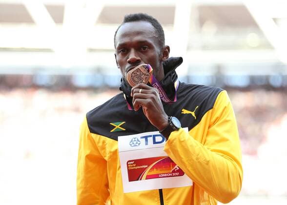 August 6th 2017, London Stadium, East London, England; IAAF World Championships; Day 3; Usain Bolt of Jamaica kisses the Bronze medal for finishing 3rd in the Men s 100 metres final xJohnxPatrickxFletcherx  ActionPlus11912373