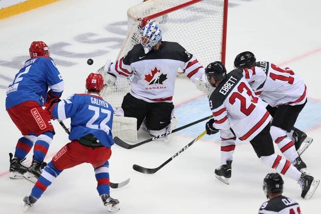 SOCHI, RUSSIA - AUGUST 7, 2017: Canada s goaltender Justin Peters (C) supported by Karl Stollery and Andrew Ebbett (R-L) defends against Kirill Kaprizov and Stanislav Galiyev (L-R) of the Russian Olympic team in their Sochi Hockey Open 2017 match at Sochi s Bolshoi Palace of Sports. Artyom Korotayev TASS  TS05A8E7