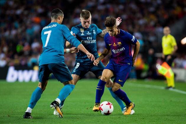 August 13th 2017, Nou Camp, Barcelona, Spain; Spanish Football Supercopa 1st Leg FC Barcelona Barca versus Real Madrid; Denis Suarez of FC Barcelona challenged by Cristiano Ronaldo of Real Madrid xActionxPlusx  ActionPlus11916233