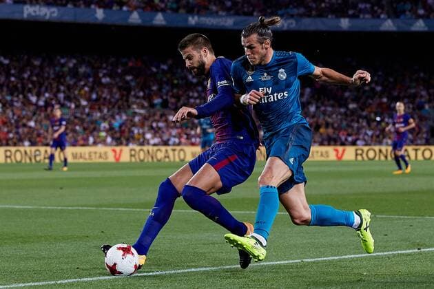 August 13th 2017, Nou Camp, Barcelona, Spain; Spanish Football Supercopa 1st Leg FC Barcelona Barca versus Real Madrid; Gerard Pique (L) of FC Barcelona competes for the ball with Gareth Bale of Real Madrid CF; xDavidxAliagax  ActionPlus11916313