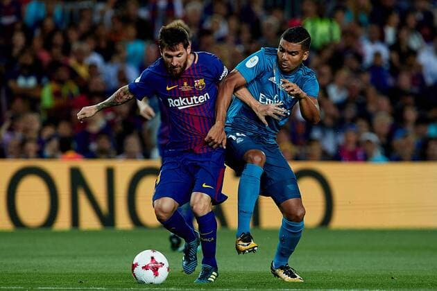 August 13th 2017, Nou Camp, Barcelona, Spain; Spanish Football Supercopa 1st Leg FC Barcelona Barca versus Real Madrid; Leo Messi (L) of FC Barcelona competes for the ball with Casemiro of Real Madrid CF; xDavidxAliagax  ActionPlus11916318