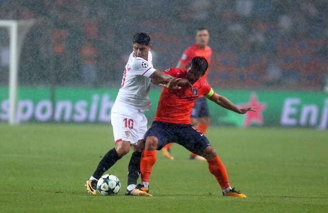 Sevilla s Ever Banega and Medipol Basaksehir™s Emre Belozoglu during Medipol Basaksehir - Sevilla UEFA Champions League Play - Off 1st round game at Istanbul Fatih Terim Stadium, 16th August, 2017.  Copyright: TolgaxAdanali STA_1985