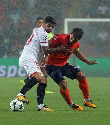Emre Belozoglu of Basaksehir and Ever Banega of Sevilla during the UEFA Champions League Play Off first leg football match Medipol Basaksehir vs FC Sevilla, on August 16 2017 at the Basaksehir Fatih Terim Stadium in Istanbul , Turkey. 