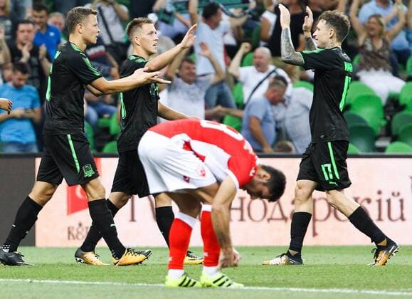 KRASNODAR, RUSSIA - AUGUST 17, 2017: FC Krasnodarâ€™s Viktor Claesson, Sergei Petrov, and Pavel Mamayev (L-R back) celebrate scoring in their 2017 2018 UEFA Europa League Playoff 1st Leg football match against Crvena Zvezda Belgrade at Krasnodar Stadium. Vitaly Timkiv TASS  TS05BC4B