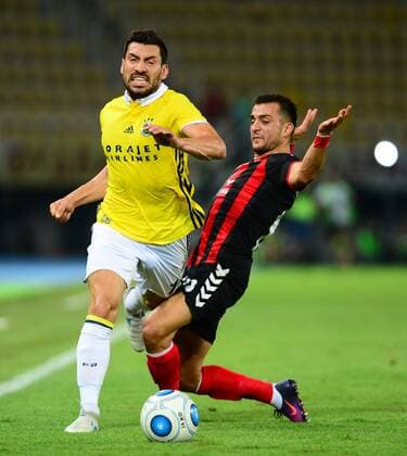 Sener Ozbayrakli of Feenrbahce and Besir Demiri of Vardar Skopje during the UEFA Europa League Play off firt leg match between FK Vardar Skopje and Fenerbahce at Nacionalna Arena Filip II Makedonski Stadium in Skopje , Makedonia on August 17 , 2017. 