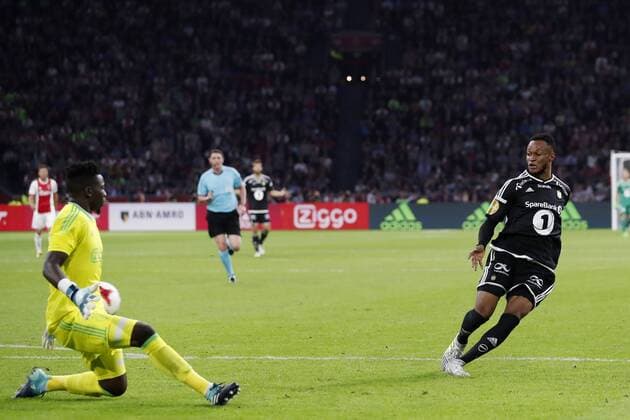 AMSTERDAM, Stadion Arena , 17-08-2017 . Voorronde Europa League seizoen 2017 2018 . Ajax - Rosenborg BK . Rosenborg-speler Adenyi Adegbenro Samuel scoort de 0-1 en passeert Andre Onana . Ajax - Rosenborg  x1673696x