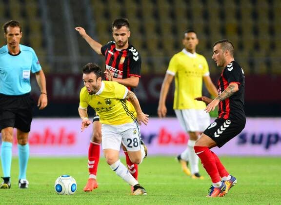 Mathieu Valbuena of Fenerbahce and Dejan Blazevski of Vardar during the UEFA Europa League Play off firt leg match between FK Vardar Skopje and Fenerbahce at Nacionalna Arena Filip II Makedonski Stadium in Skopje , Makedonia on August 17 , 2017. Final Scores : Vardar Skopje 2 - Fenerbahce 0 