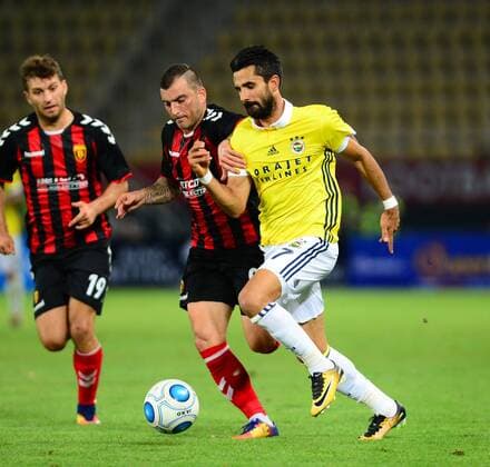 Alper Potuk of Fenerbahce and Dejan Blazevski 9 , Hovhannes Hambardzumyan 19 of Vardar during the UEFA Europa League Play off firt leg match between FK Vardar Skopje and Fenerbahce at Nacionalna Arena Filip II Makedonski Stadium in Skopje , Makedonia on August 17 , 2017. Final Scores : Vardar Skopje 2 - Fenerbahce 0 