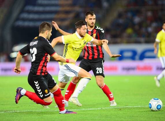 Ahmethan Kose of Fenerbahce and Boban Nikolov 20 , Besir Demiri 23 of Vardar during the UEFA Europa League Play off firt leg match between FK Vardar Skopje and Fenerbahce at Nacionalna Arena Filip II Makedonski Stadium in Skopje , Makedonia on August 17 , 2017. Final Scores : Vardar Skopje 2 - Fenerbahce 0 