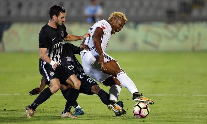 (170818) -- BELGRADE, Aug. 18, 2017 -- Partizan s Marko Jankovic (L) vies with Videoton s Ezekiel Isoken Henty (R) during the UEFA Europa League play-offs first leg football match between Partizan and Videoton in Belgrade, Serbia, on Aug. 17, 2017. The match ended 0-0 tie. ) (SP)SERBIA-BELGRADE-SOCCER-UEFA-PARTIZAN VS VIDEOTON PredragxMilosavljevic 