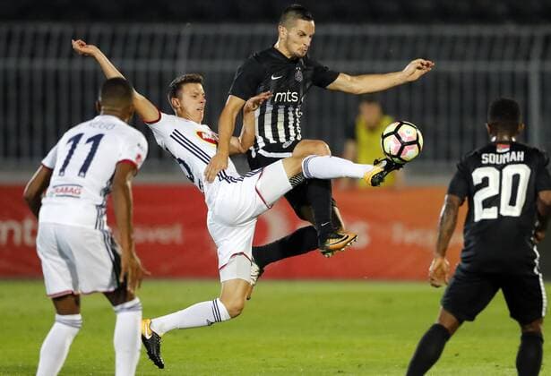 (170818) -- BELGRADE, Aug. 18, 2017 -- Partizan s Nemanja Miletic (2nd R) vies with Videoton s Bence Szabo (2nd L) during the UEFA Europa League play-offs first leg football match between Partizan and Videoton in Belgrade, Serbia, on Aug. 17, 2017. The match ended 0-0 tie. ) (SP)SERBIA-BELGRADE-SOCCER-UEFA-PARTIZAN VS VIDEOTON PredragxMilosavljevic 